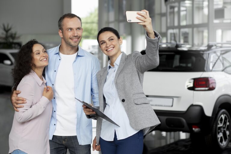couple searching new car dealership